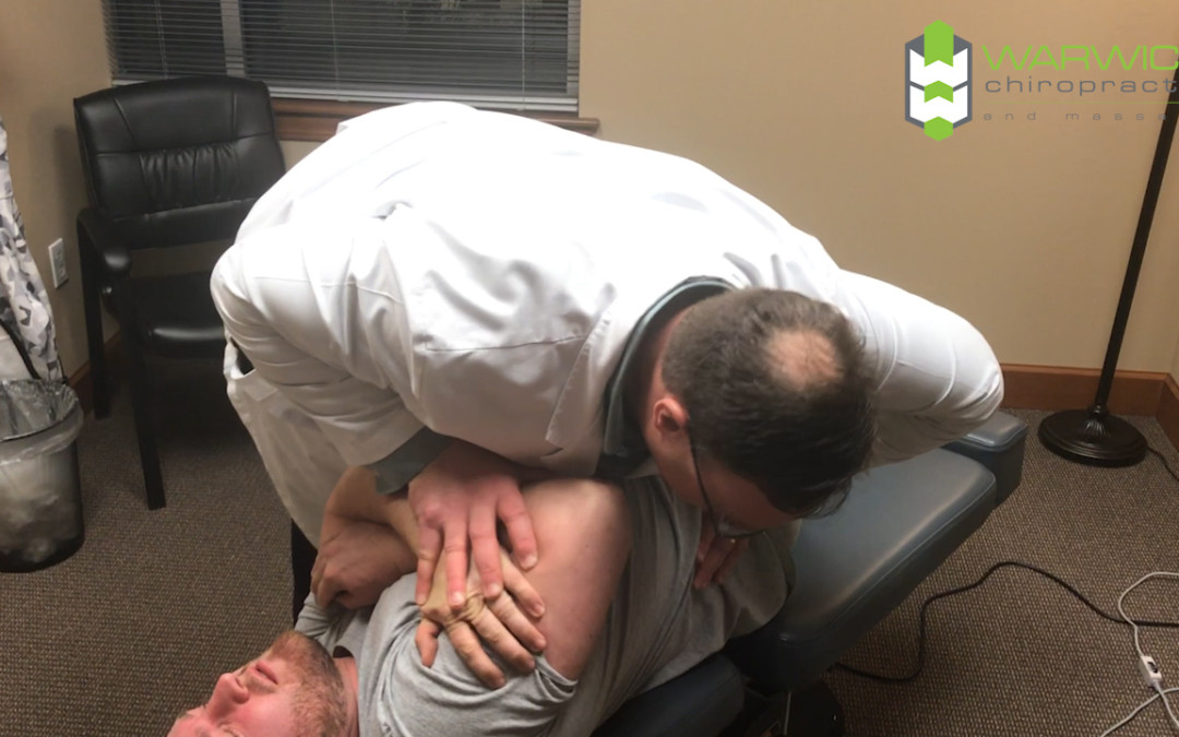 back adjustment on patient by dr Warwick