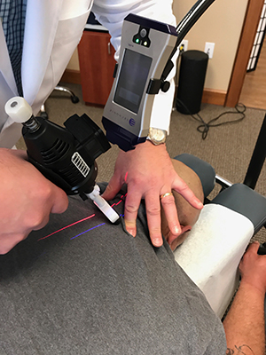 laser treatment and adjustment at Warwick chiropractic