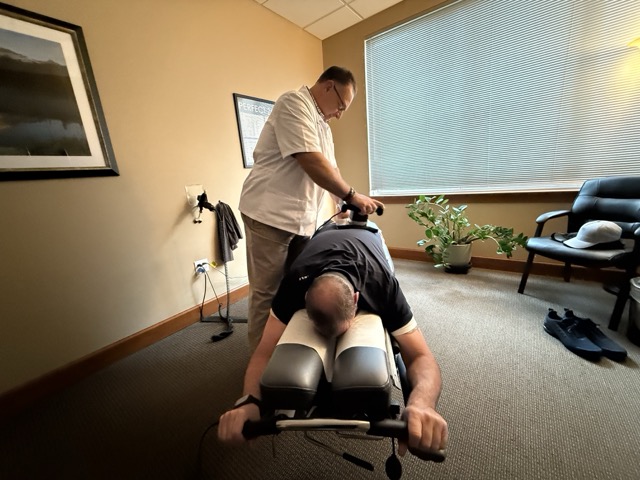 Patient receiving an adjustment at Warwick Chiropractic & Massage in Lacey